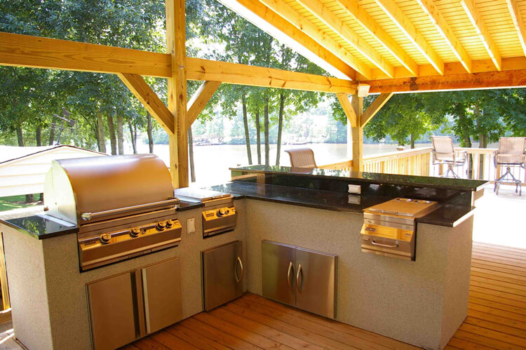Custom outdoor kitchen under covered porch