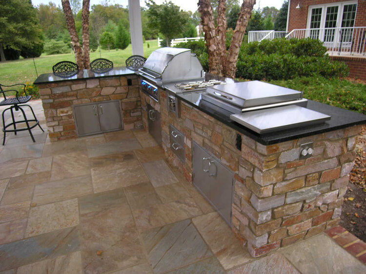 Custom outdoor kitchen with dining bar