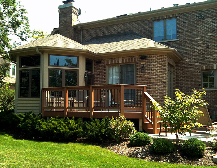 Custom sun room with low maintenance deck