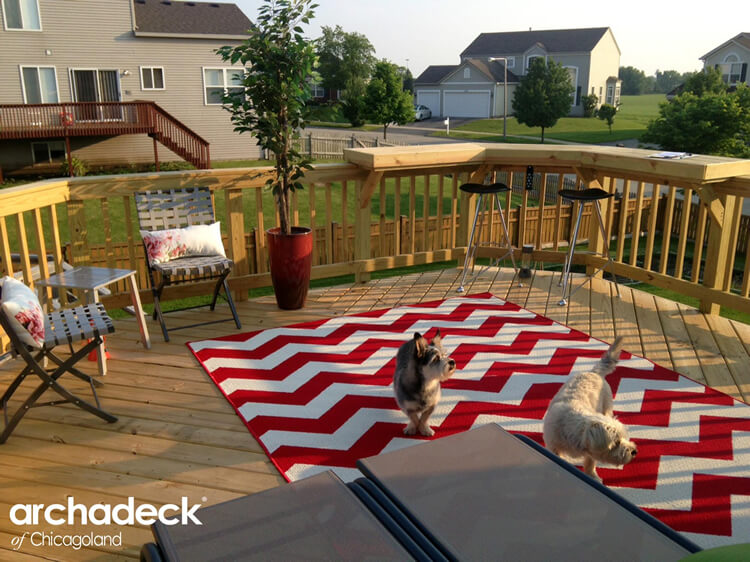 Custom wood deck with built in bar rail