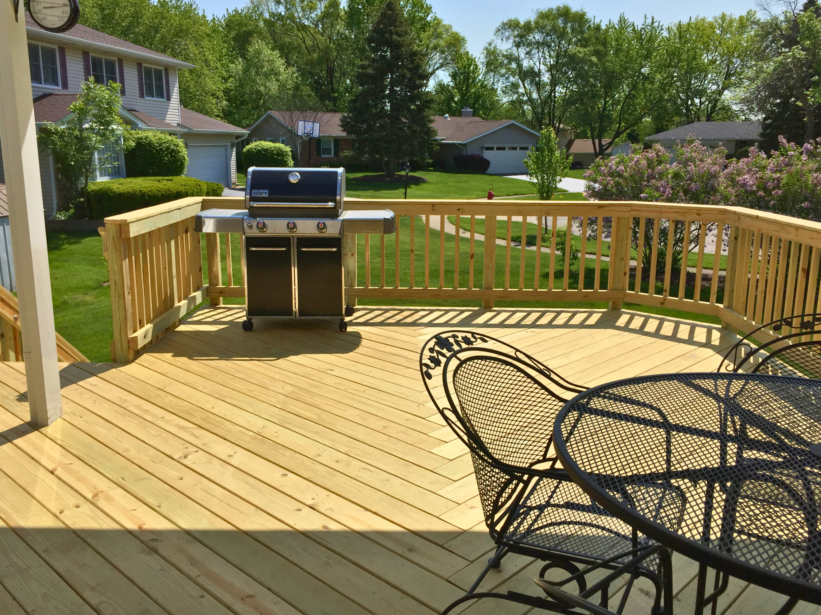 Wood deck with wood rails installed by Archadeck of Chicagoland.