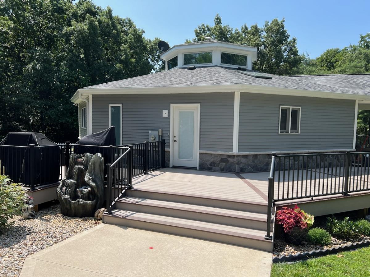 patio with stairs leading to deck