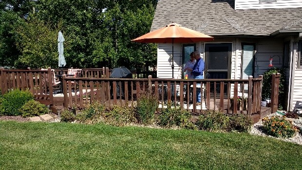Couple on old backyard deck