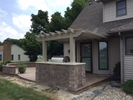 Custom patio with pergola and outdoor kitchen