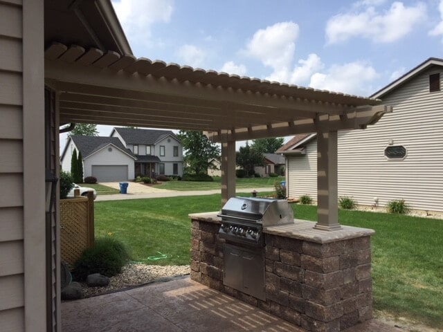 Custom patio with pergola and outdoor kitchen