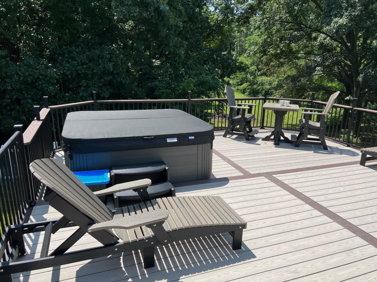 chase lounge chair and hot tub on deck