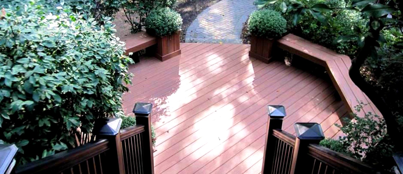 Deck surrounded by greenery.