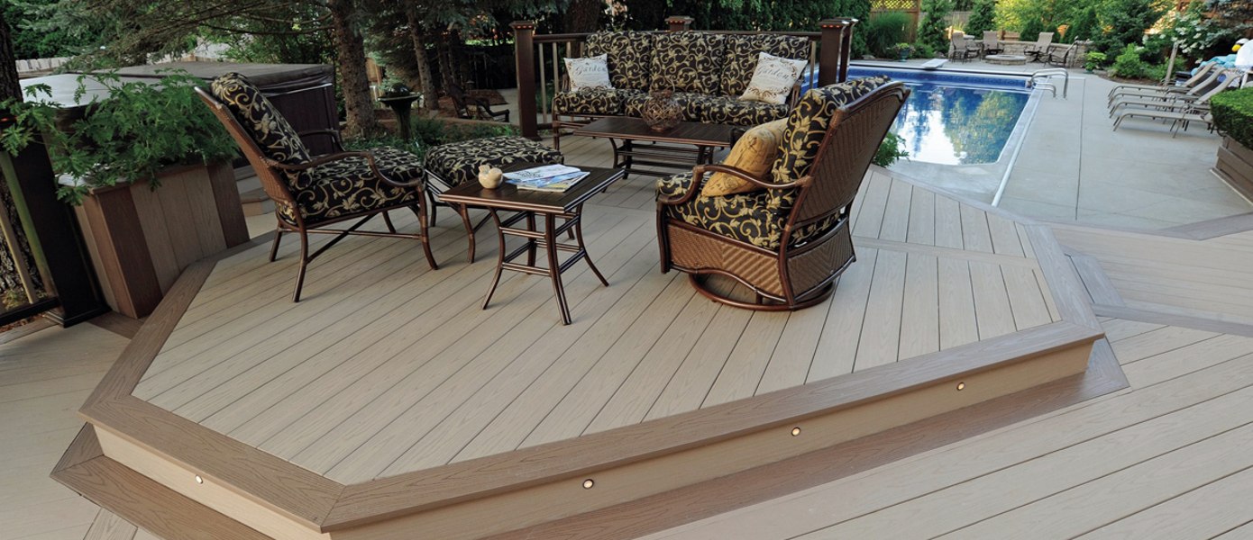 Unique, furnished deck next to a pool.