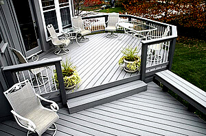 Custom multi-level deck with railing and floating bench