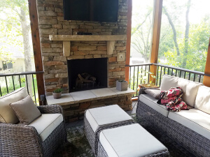 Outdoor fireplace on screened porch