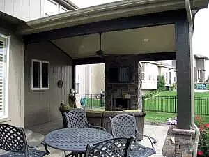 Custom outdoor fireplace on backyard porch