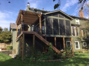 Backyard screened porch and deck with pergola
