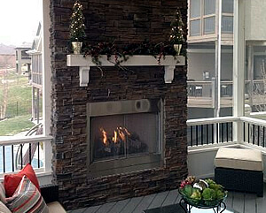 Outdoor fireplace on screened porch