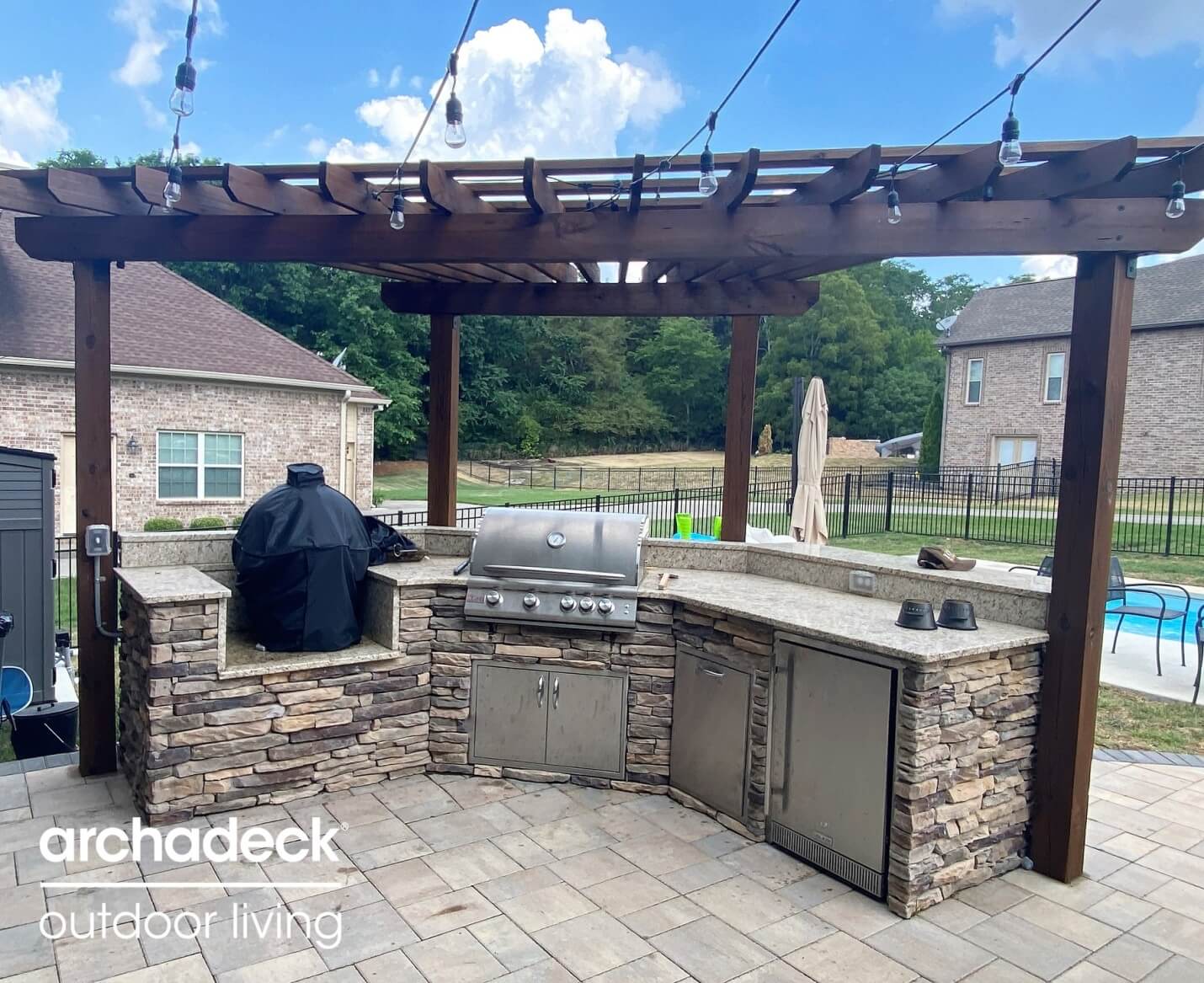 custom outdoor kitchen with pergola
