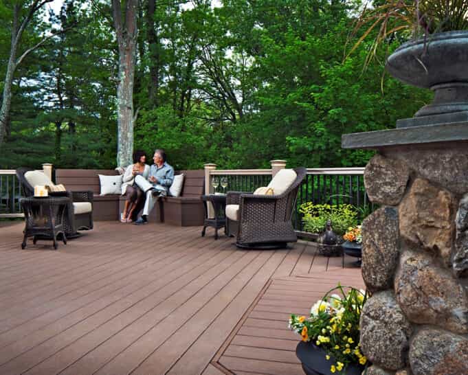 couple on deck with bench seating