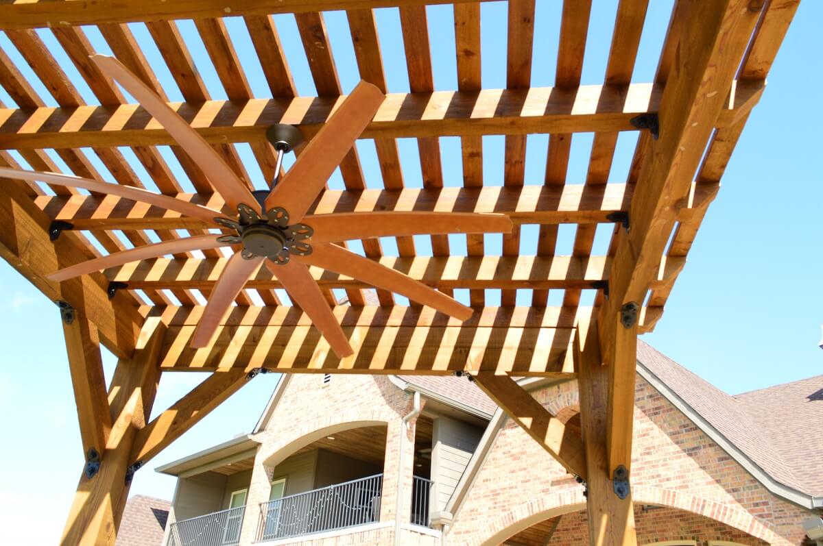 Cedar Pergola with decorative brackets and oversized ceiling fan