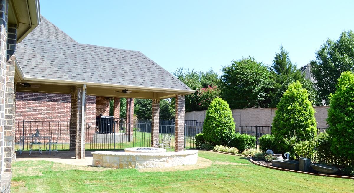 Custom-covered-patio-extension-and-custom-backyard-fire-feature-in-Colleyville