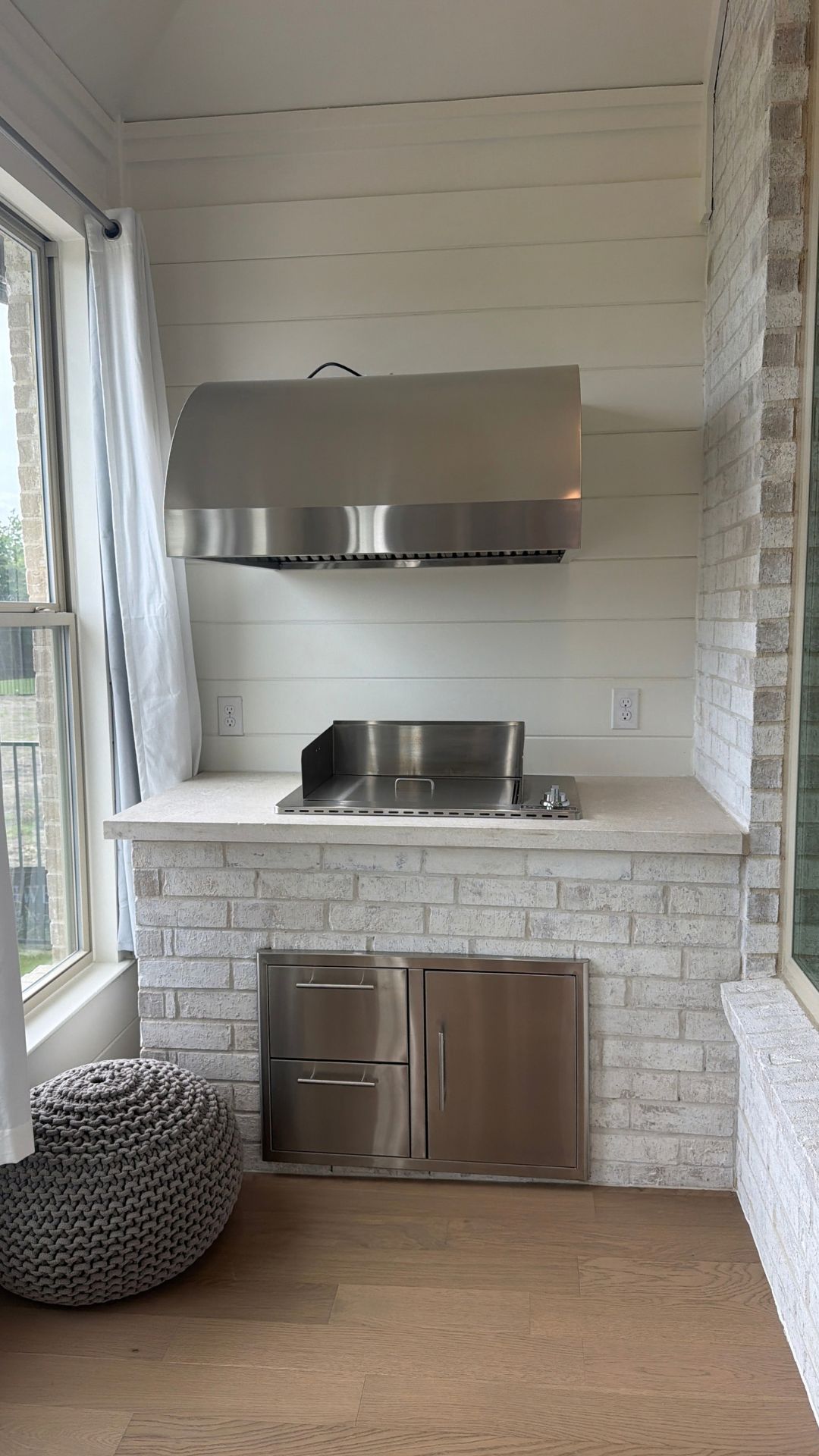custom outdoor kitchen grill station within 4-season room
