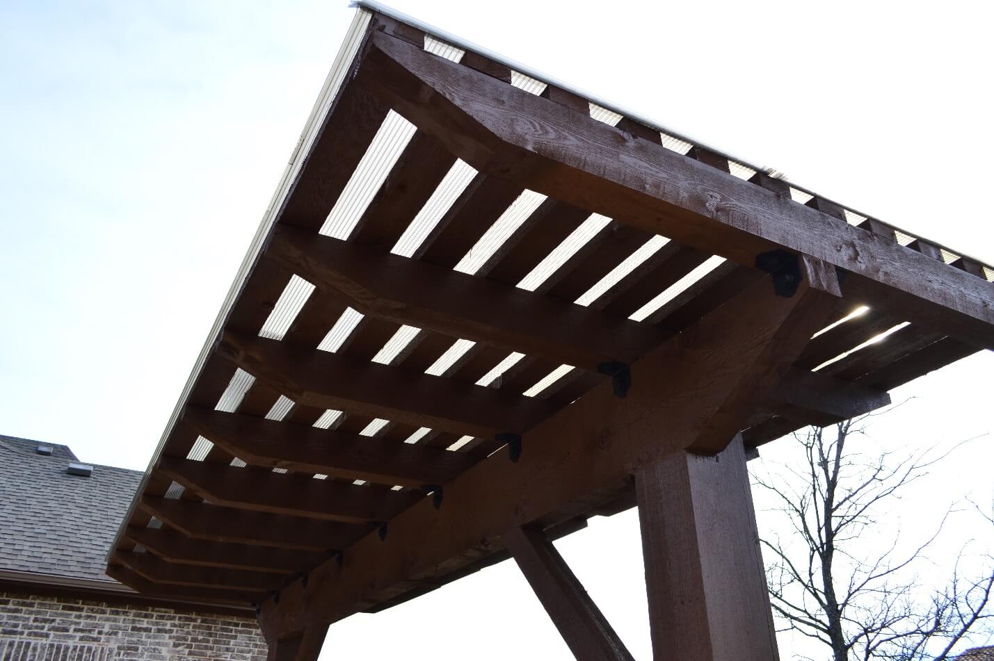 Stunning-pergola-features-a-polygal-cover-and-room-for-the-homeowner's-hammock