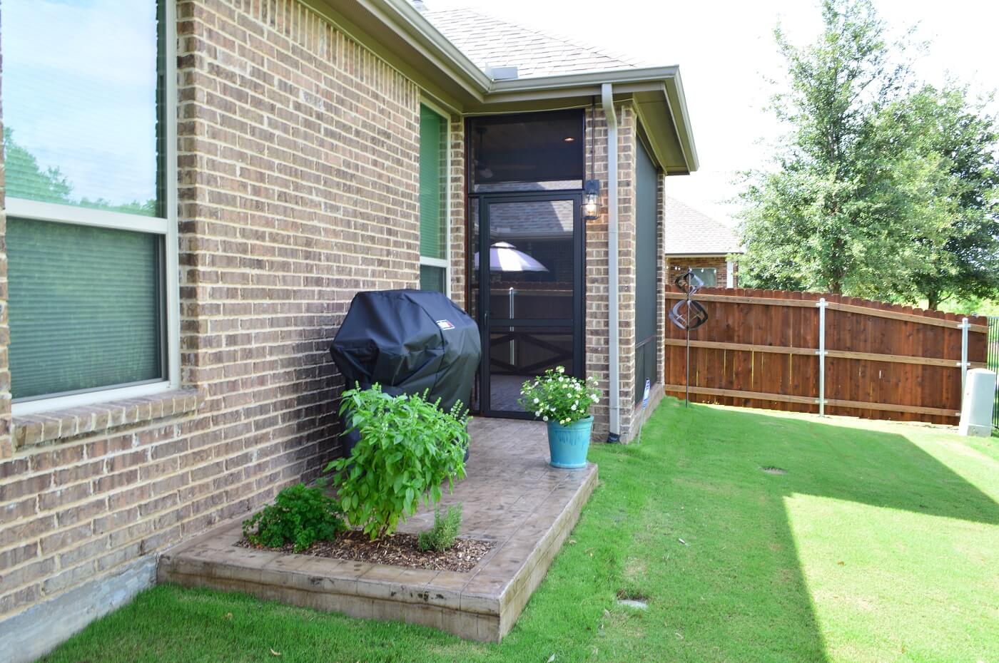 The-area-for-the-herb-garden-makes-it-easy-for-the-homeowners-to-access-fresh-herbs-when-grilling