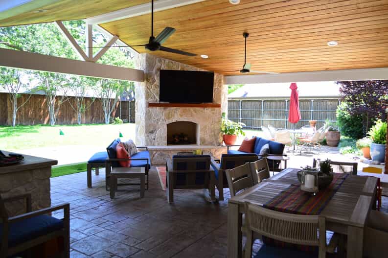 custom gable roof patio cover with outdoor fireplace