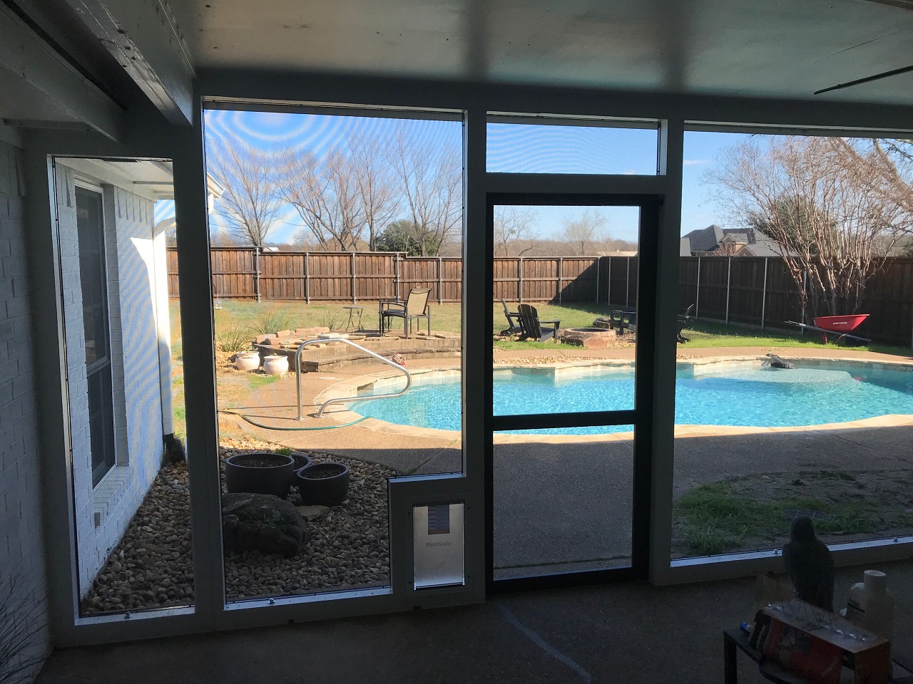 screened in poolside patio with doggie door