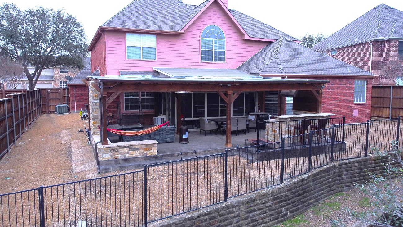 red house with covered back patio