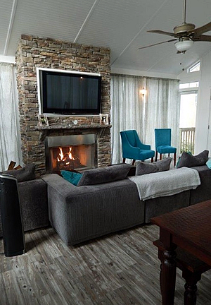Sunroom with stone fireplace