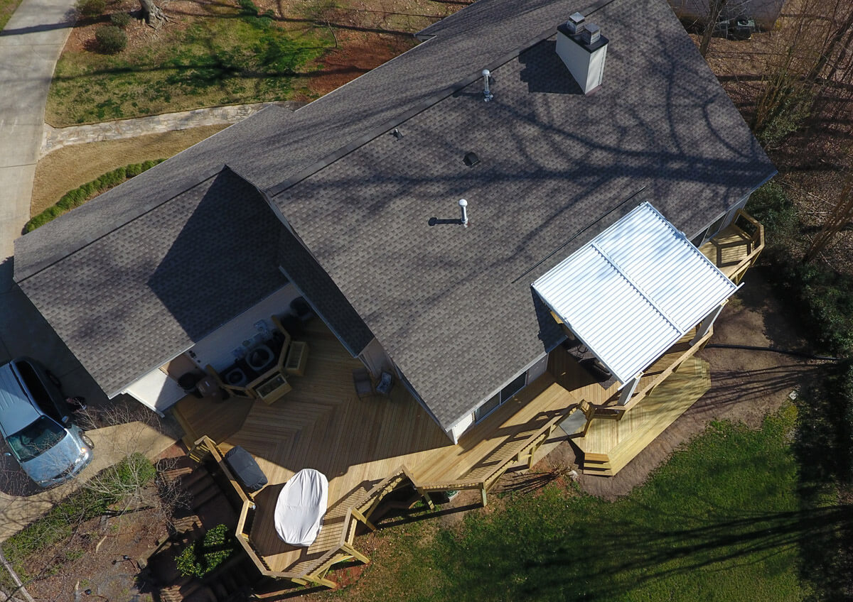 A Customized Cary Deck and Patio Expansion Complements This Bright and