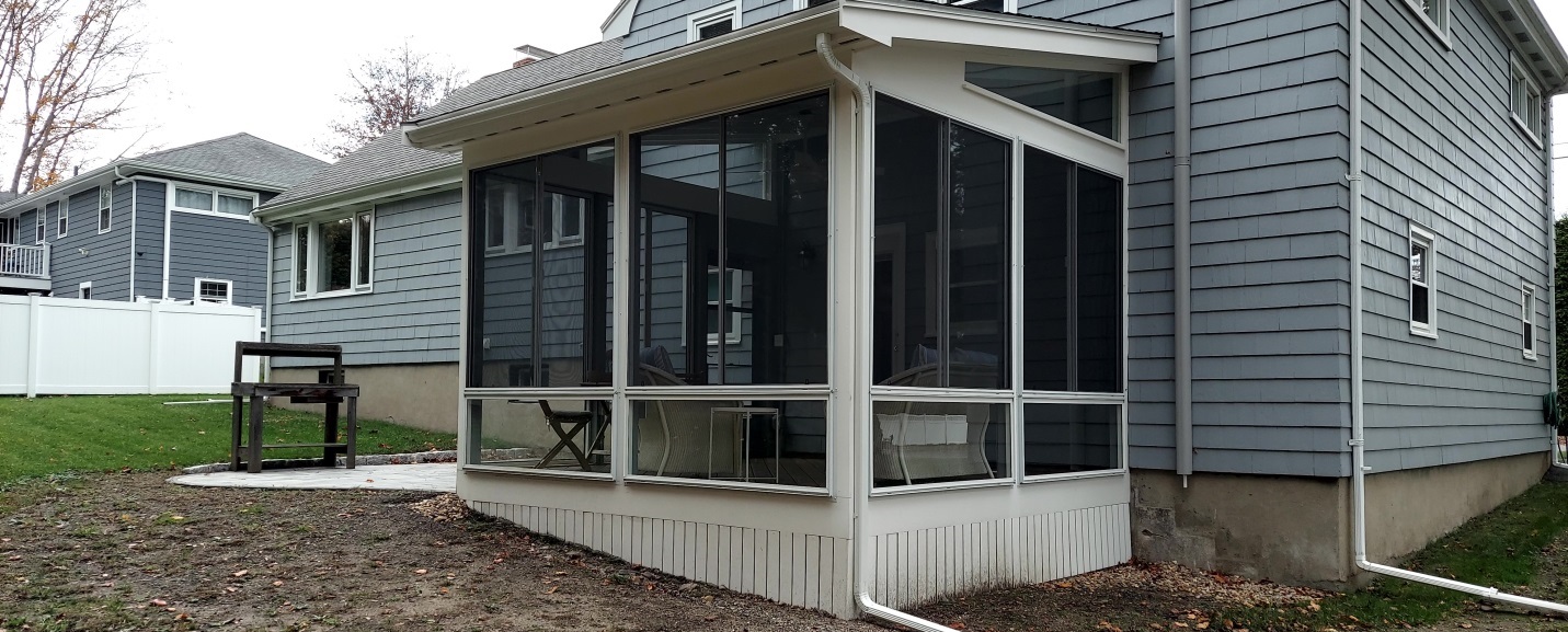 blue house with small deck in the back