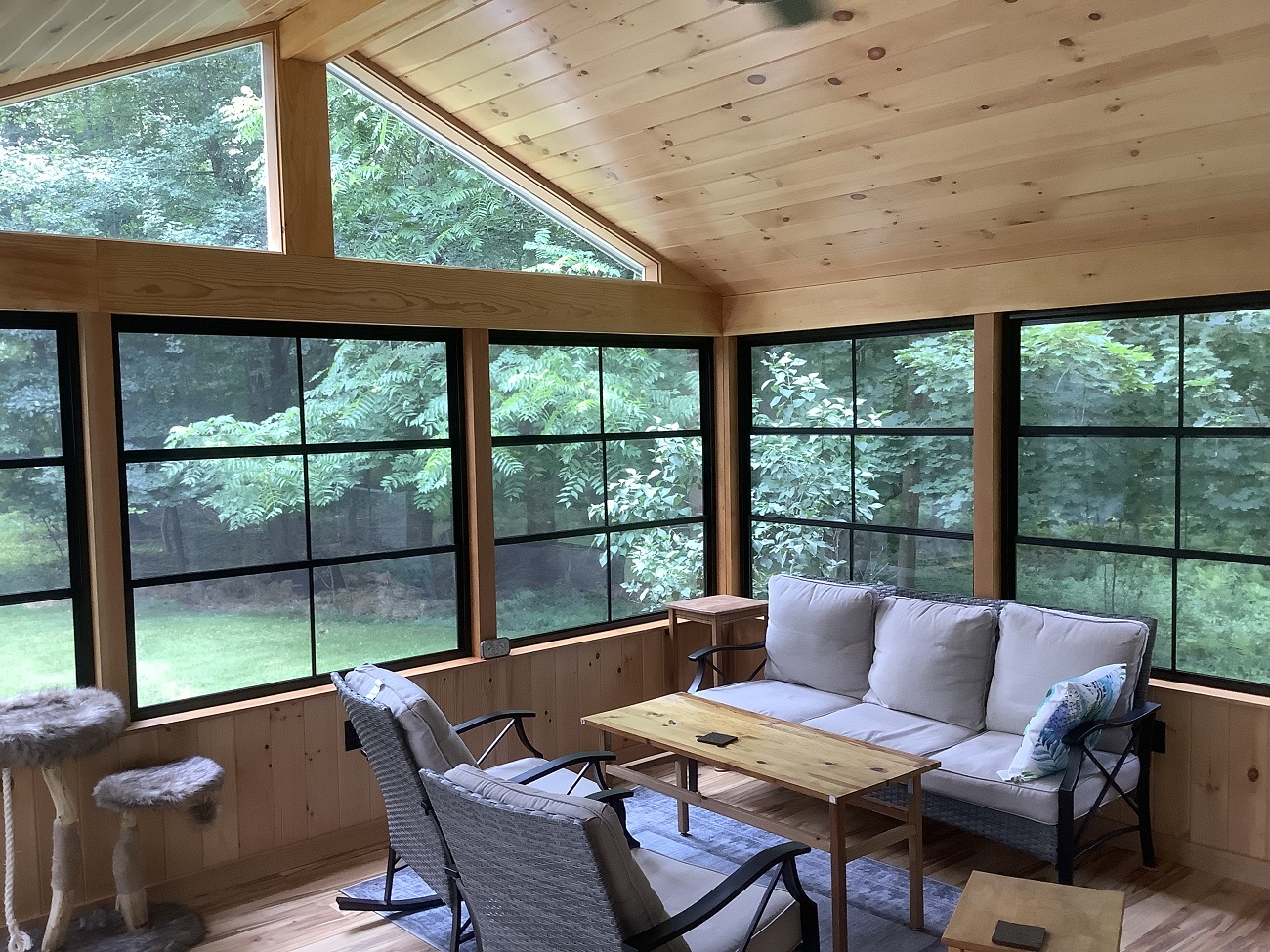 pine interior three season room with couches