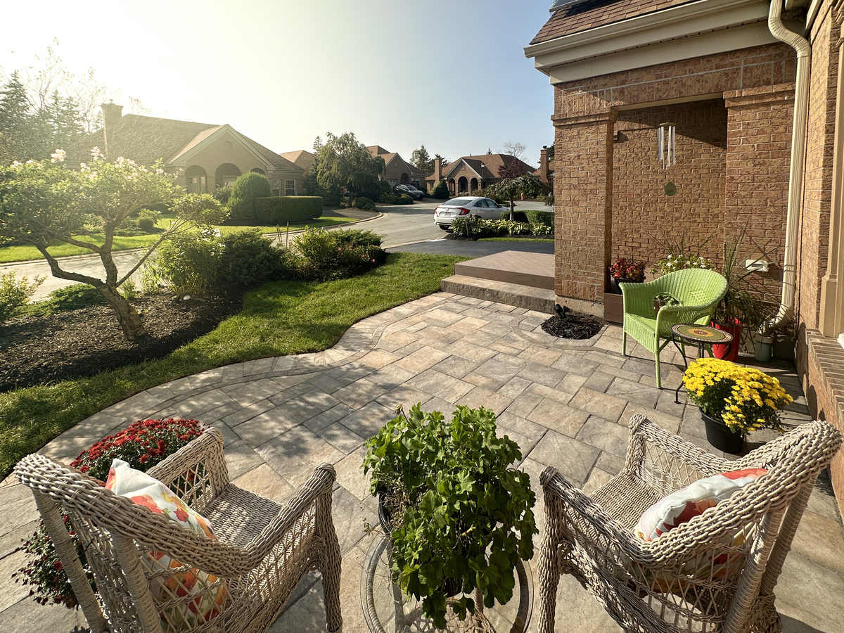 paver sitting area in the front of a home