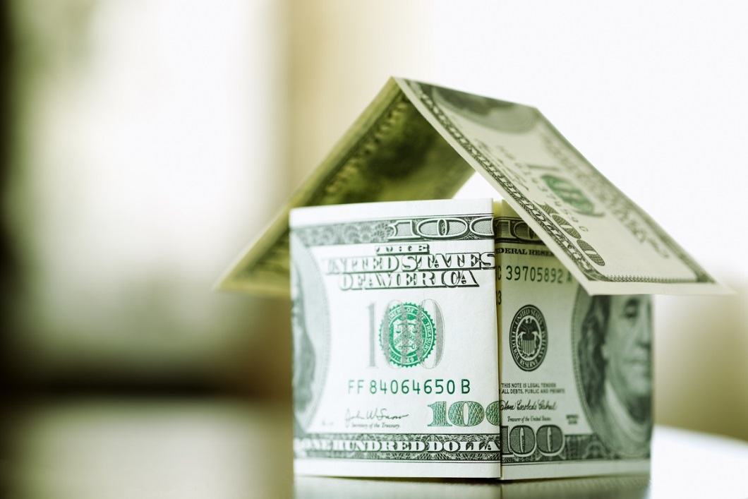 tiny house built of hundred dollar bills