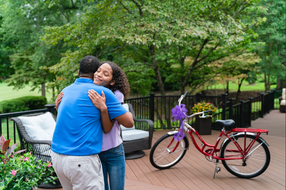 people hugging on deck