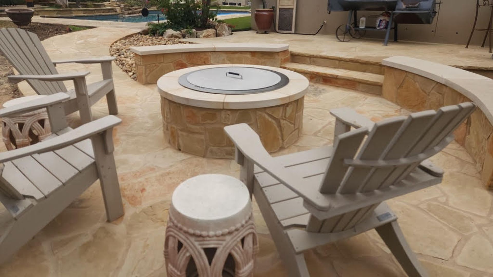 patio with seating walls and fire pit