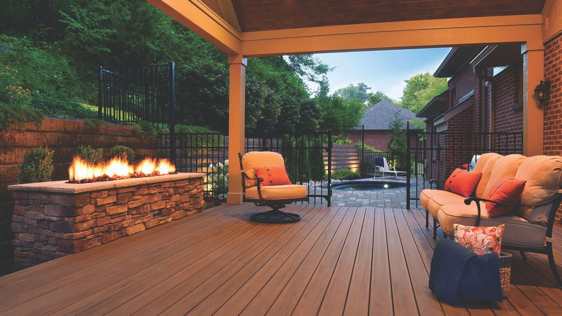 custom outdoor living space with patio, porch and fire feature